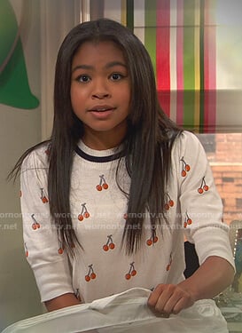 Nia’s white cherry print top on Ravens Home