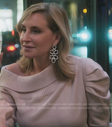 Sonja’s pink off shoulder sweater on The Real Housewives of New York City