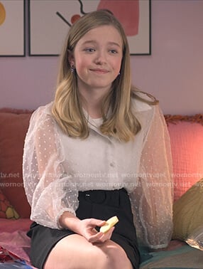 Stacey’s white dotted sheer blouse on The Baby-Sitters Club