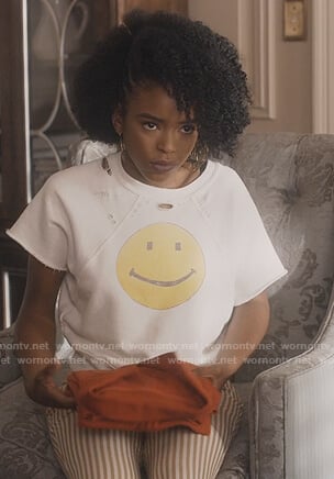 Zora’s white smiley face sweatshirt on Greenleaf