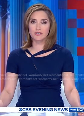 Margaret’s blue twisted neckline dress on CBS Evening News
