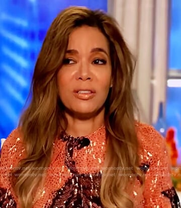 Sunny’s orange metallic floral blouse on The View