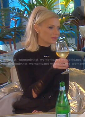 Dorit’s black distressed sleeve knit top on The Real Housewives of Beverly Hills