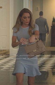 Debbie’s blue ruffle hem dress with white piping on Teenage Bounty Hunters