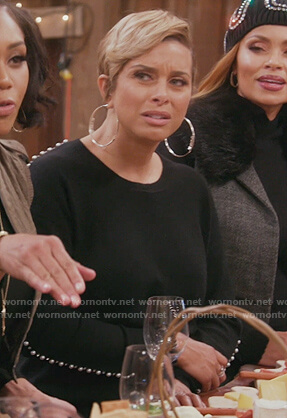 Robyn’s black pearl sleeve sweater on The Real Housewives of Potomac