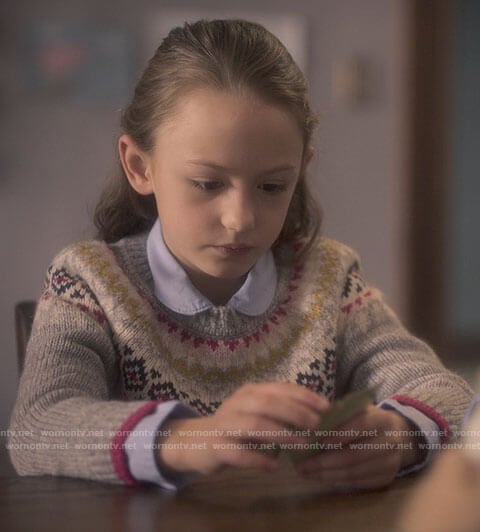 Flora’s fair isle print sweater on The Haunting of Bly Manor