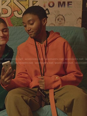 Caitlin’s orange hoodie on We Are Who We Are