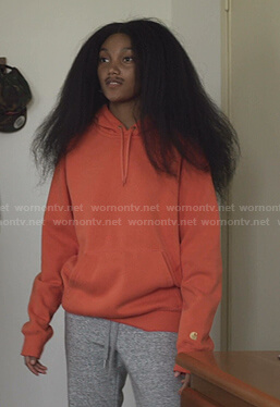 Caitlin’s orange hoodie on We Are Who We Are