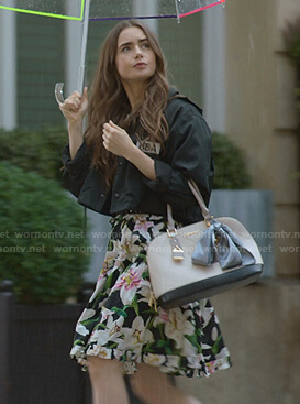 Emily’s black jacket and floral print off-shoulder dress on Emily in Paris