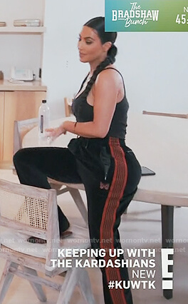 Kim’s black velvet side stripe pants on Keeping Up with the Kardashians