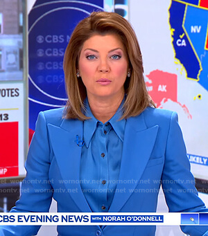 Norah’s blue satin shirt and peak lapel blazer on CBS Evening News