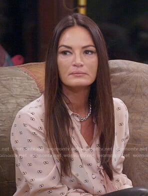 Lisa’s pink V logo print blouse on The Real Housewives of Salt Lake City