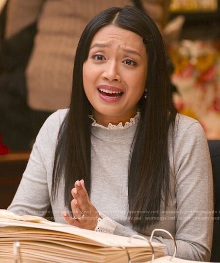 Liz’s grey eyelet trim sweater on Holidate