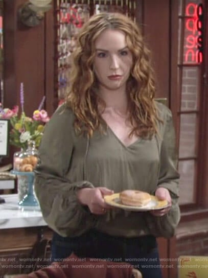 Mariah’s green blouse with ruched sleeves on The Young and the Restless