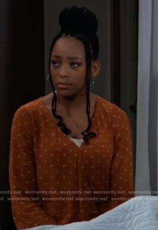Trina’s orange printed wrap top on General Hospital