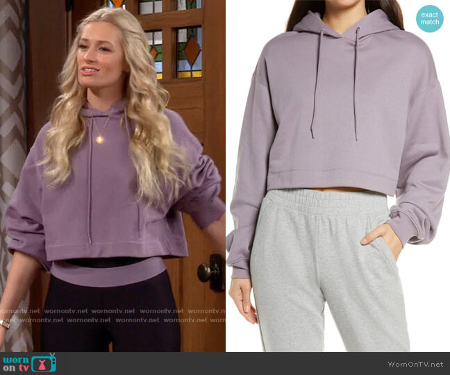 Alo Bae Crop Hoodie in Lavender Smoke worn by Gemma (Beth Behrs) on The Neighborhood