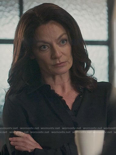 Miranda’s black fringe trim blouse on The Flight Attendant
