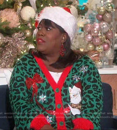 Sheryl’s green Christmas cat cardigan on The Talk