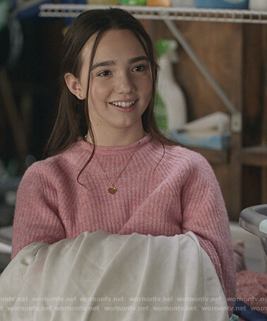 Grace’s pink mock neck sweater on The Unicorn