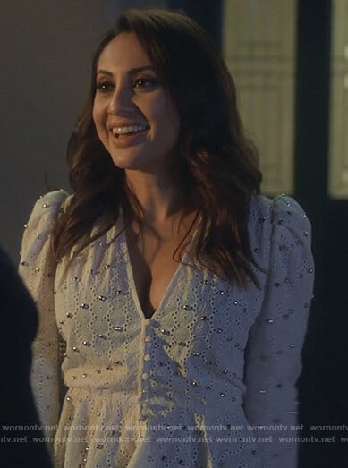 Ana’s white studded v-neck blouse on Grown-ish