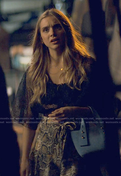 Bette’s black lace top, snake print skirt and blue mini bag on Tiny Pretty Things