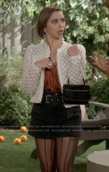 Celia’s white puff sleeve jacket and denim shorts on Call Your Mother