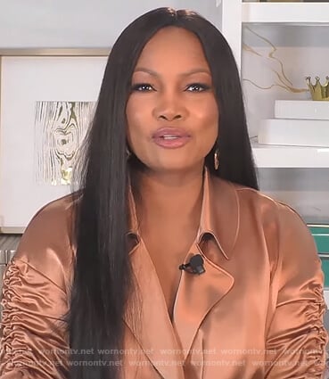 Garcelle’s brown satin ruched sleeve top on The Real