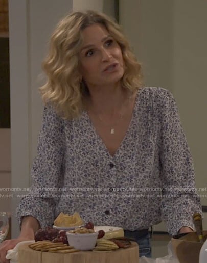 Jean’s blue floral v-neck top on Call Your Mother