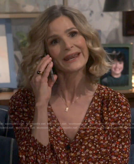 Jean’s red floral v-neck button up top on Call Your Mother