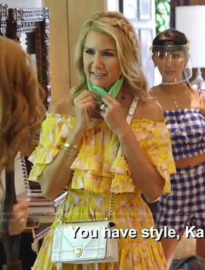 Kary’s yellow floral ruffle off-shoulder dress on The Real Housewives of Dallas