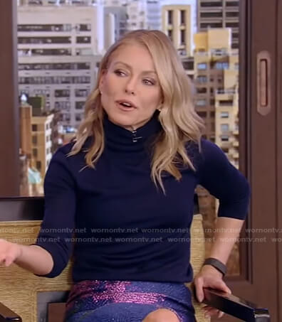 Kelly’s navy turtleneck sweater and floral skirt on Live with Kelly and Ryan