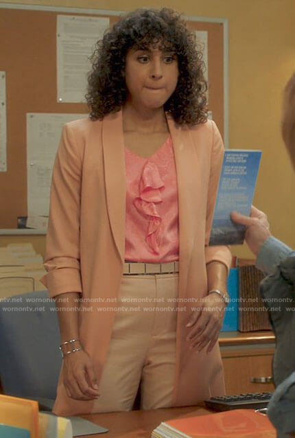 Mikaela’s pink ruffled front top and long coral jacket on Mr Mayor