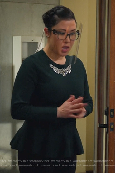 Sherri’s dark green embellished peplum sweater on All Rise