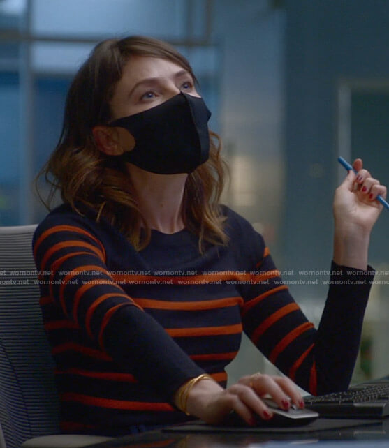Taylor’s navy and orange striped sweater on Bull