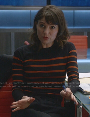 Taylor’s navy and orange striped sweater on Bull