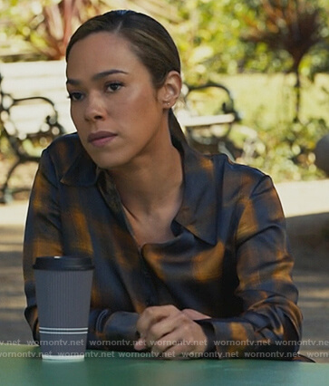 Emily’s black and yellow plaid satin blouse on All Rise