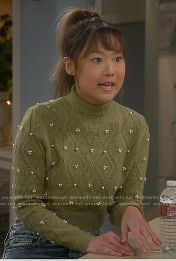 Jen’s green pointelle sweater with pearls on Last Man Standing