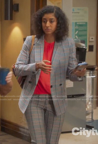 Mikaela’s plaid suit and red blouse on Mr Mayor