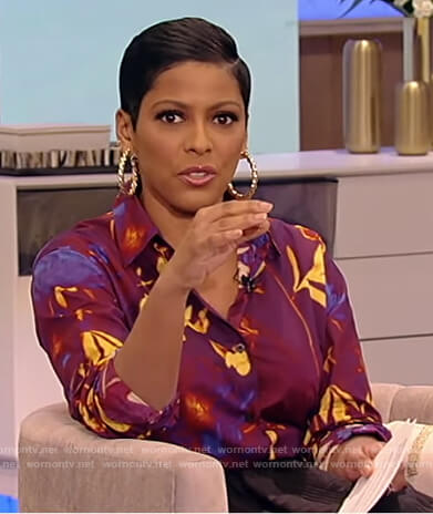 Tamron’s purple floral print blouse on Tamron Hall Show