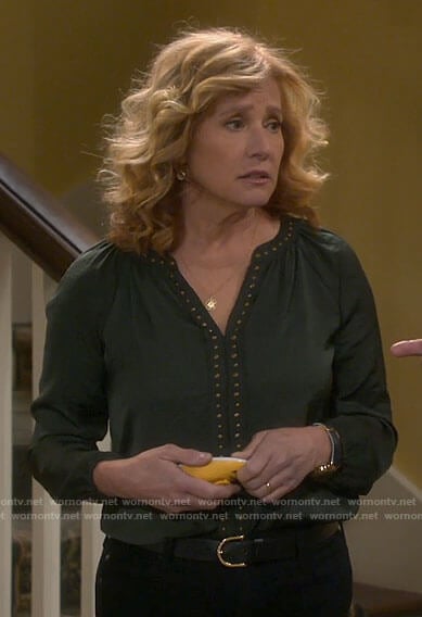Vanessa’s green studded v-neck top on Last Man Standing