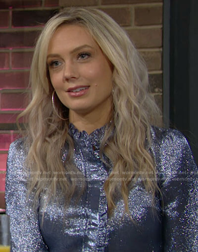 Abby’s blue metallic blouse with ruffled trim on The Young and the Restless