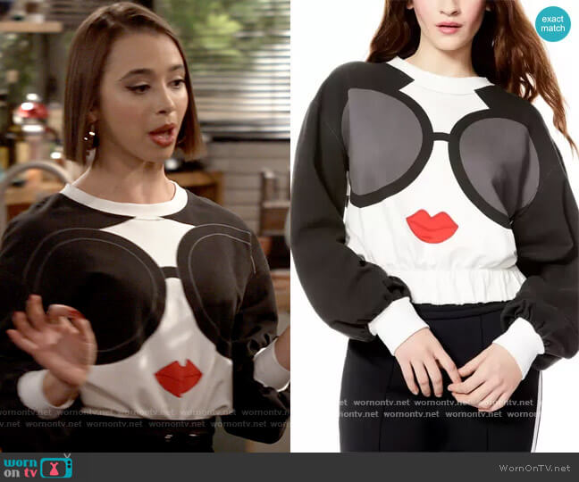Alice + Olivia Gaia Graphic Blouson Crop Sweatshirt worn by Celia (Emma Caymares) on Call Your Mother