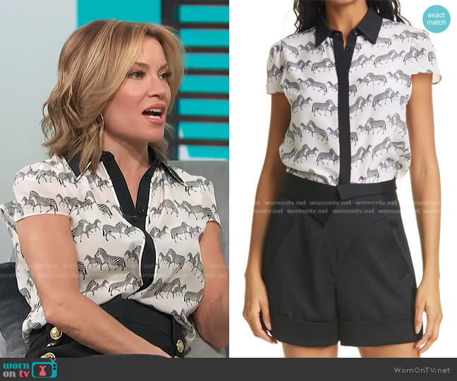 Alice + Olivia Latrina Zebra Print Short Sleeve Silk Blouse worn by Kit Hoover on Access Hollywood