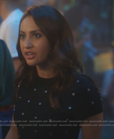 Ana’s black grommet embellished dress on Grown-ish