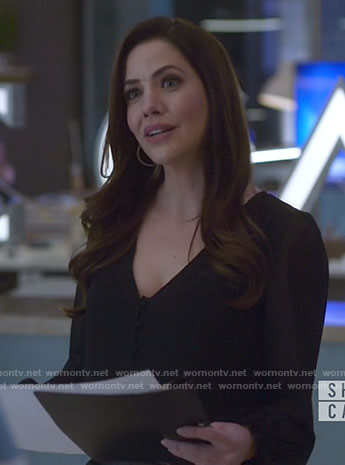 Andrea’s black v-neck blouse on Supergirl