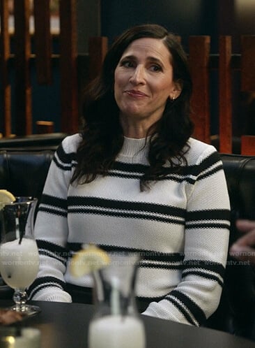 Delia’s black and white striped knit sweater on The Unicorn