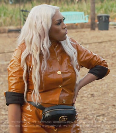 Drew’s orange leather button jacket and skirt on The Real Housewives of Atlanta