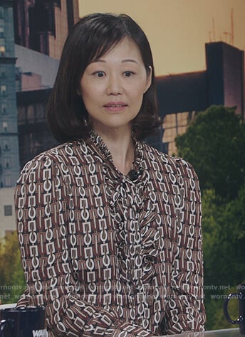 Ellen’s geometric print blouse on Kenan
