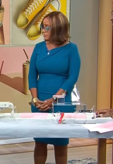 Gayle’s teal blue asymmetric v-neck dress on CBS This Morning