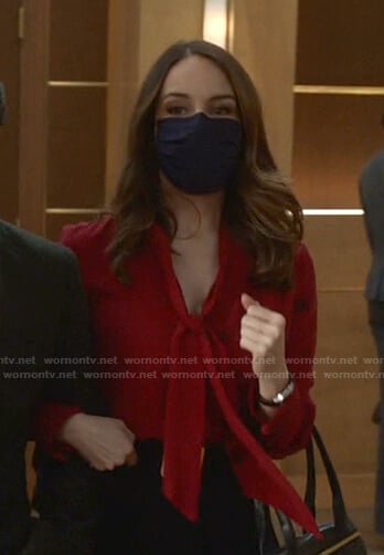 Izzy’s red floral tie neck blouse on Bull